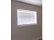 A window with white blinds brightens the room with natural light at 4830 Kempston Dr, Orlando, FL 32812
