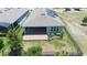 Aerial view of a home featuring solar panels and a paver patio at 518 Briarbrook Way, Deland, FL 32724