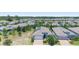 Neighborhood aerial view showcasing houses with solar panels and landscaping at 518 Briarbrook Way, Deland, FL 32724