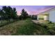 A spacious fenced backyard with lush lawn and exterior views at 518 Briarbrook Way, Deland, FL 32724