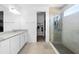 Bright bathroom featuring double sink vanity with granite counters, glass shower and closet at 518 Briarbrook Way, Deland, FL 32724