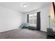 Bedroom with carpet, large window, and neutral walls at 518 Briarbrook Way, Deland, FL 32724