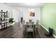 Dining area has a modern chandelier, hard surface flooring, and is open to the living areas of the home at 518 Briarbrook Way, Deland, FL 32724