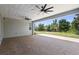 Large covered patio boasts dual ceiling fans and is ready for outdoor entertaining at 518 Briarbrook Way, Deland, FL 32724