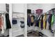 Organized walk-in closet with shelving, hanging rods, and built-in shoe storage solutions at 518 Briarbrook Way, Deland, FL 32724