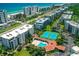 Aerial view of the condo community showcasing the pool, tennis courts, and proximity to the beach at 5300 S Atlantic Ave # 12-403, New Smyrna Beach, FL 32169