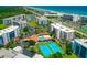 Overhead view showcasing the condo complex amenities: pool, tennis courts, and beach access at 5300 S Atlantic Ave # 12-403, New Smyrna Beach, FL 32169
