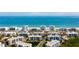 Aerial view of beachfront condo community with sparkling blue ocean in the background at 5300 S Atlantic Ave # 12-403, New Smyrna Beach, FL 32169