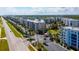 Aerial view of community condos, featuring a pool, lush landscaping, and secure gated entry at 5300 S Atlantic Ave # 12-403, New Smyrna Beach, FL 32169