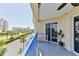 This charming balcony features ample seating and picturesque views of the community and its amenities at 5300 S Atlantic Ave # 12-403, New Smyrna Beach, FL 32169
