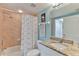 Bathroom with a toilet, vanity with granite countertop, and a shower behind a patterned curtain at 5300 S Atlantic Ave # 12-403, New Smyrna Beach, FL 32169