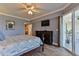 Serene bedroom featuring a king bed, wood flooring, and a private balcony for outdoor relaxation at 5300 S Atlantic Ave # 12-403, New Smyrna Beach, FL 32169