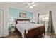 Well-lit bedroom with a large window, side tables, and decorative lamps and flooring at 5300 S Atlantic Ave # 12-403, New Smyrna Beach, FL 32169