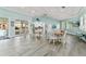 Spacious common area with seating, a kitchenette, and access to the pool at 5300 S Atlantic Ave # 12-403, New Smyrna Beach, FL 32169