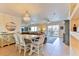 Dining room with chandelier lighting, large mirror, and open access to living room at 5300 S Atlantic Ave # 12-403, New Smyrna Beach, FL 32169