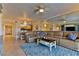 Inviting living room features tile floors, stylish furniture, and an open layout to the kitchen and dining area at 5300 S Atlantic Ave # 12-403, New Smyrna Beach, FL 32169