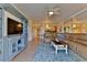 Charming living room boasting comfortable seating, an entertainment center, and an open floor plan at 5300 S Atlantic Ave # 12-403, New Smyrna Beach, FL 32169