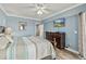 Lovely bedroom with beach view, dresser and storage, featuring an ensuite bathroom at 5300 S Atlantic Ave # 12-403, New Smyrna Beach, FL 32169