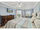 Comfortable bedroom with large dresser, beach view, access to the balcony, and natural light at 5300 S Atlantic Ave # 12-403, New Smyrna Beach, FL 32169