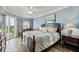 Beautiful bedroom with balcony access, wooden floors, beach views and ample natural light at 5300 S Atlantic Ave # 12-403, New Smyrna Beach, FL 32169