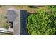 Aerial view of a single Gathering home featuring a dark gray roof and lush surrounding greenery at 541 Northwestern Ave, Altamonte Springs, FL 32714