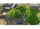 Aerial view of a spacious, enclosed backyard with ample tree coverage, utility vehicles, and recreational space at 541 Northwestern Ave, Altamonte Springs, FL 32714