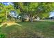 Large backyard featuring mature trees, a lush lawn, and plenty of room for outdoor enjoyment at 541 Northwestern Ave, Altamonte Springs, FL 32714