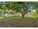 Spacious backyard featuring a lush lawn, mature trees, and a peaceful outdoor setting at 541 Northwestern Ave, Altamonte Springs, FL 32714