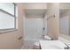 Bright bathroom features a shower-tub combo, toilet, and vanity with modern hardware at 541 Northwestern Ave, Altamonte Springs, FL 32714