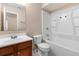 Bathroom with white fixtures including vanity, toilet, and shower-tub combination at 541 Northwestern Ave, Altamonte Springs, FL 32714