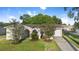 Attractive single-story home featuring a lawn, landscaping, and an attached garage at 541 Northwestern Ave, Altamonte Springs, FL 32714