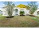 Welcoming single-story home featuring a lush front yard, landscaping, and covered entryway at 541 Northwestern Ave, Altamonte Springs, FL 32714