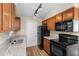 Efficient kitchen with stainless appliances and granite counters at 541 Northwestern Ave, Altamonte Springs, FL 32714
