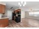 Bright kitchen featuring modern appliances, wood cabinets, and a wood-look floor that flows into the adjacent room at 541 Northwestern Ave, Altamonte Springs, FL 32714