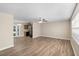 Spacious living room features new flooring, ceiling fan, and lots of natural light at 541 Northwestern Ave, Altamonte Springs, FL 32714