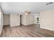 Spacious living room with wood-look flooring, a ceiling fan, and neutral paint at 541 Northwestern Ave, Altamonte Springs, FL 32714