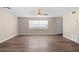 Spacious living room with wood-look flooring, a ceiling fan, and neutral paint at 541 Northwestern Ave, Altamonte Springs, FL 32714