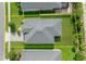 Aerial view of a home with a well-maintained lawn, showcasing the property lines at 5513 Estero Loop, Port Orange, FL 32128
