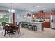 Elegant dining area next to kitchen, well lit with decorative chandelier at 5513 Estero Loop, Port Orange, FL 32128