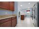 Spacious kitchen with a breakfast bar, granite countertops, and ample cabinet storage at 5513 Estero Loop, Port Orange, FL 32128