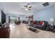 Open-concept living space with tile flooring, leading to the dining area and kitchen at 5513 Estero Loop, Port Orange, FL 32128