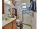 Well-lit bathroom with a walk-in tub, providing safety and accessibility for all at 5967 Plantera Ct, Port Orange, FL 32127