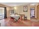 Cozy dining area with a sliding door, vintage furniture, and views of the backyard at 5967 Plantera Ct, Port Orange, FL 32127