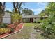 Charming single-story home with a well-maintained front yard and vibrant landscaping at 5967 Plantera Ct, Port Orange, FL 32127