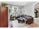 Living room with large windows, soft lighting, and comfortable seating at 5967 Plantera Ct, Port Orange, FL 32127