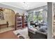 Inviting living area with large windows, bookshelves and comfortable seating at 5967 Plantera Ct, Port Orange, FL 32127