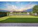 Well-maintained backyard with a fence overlooking a serene pond and neighborhood at 6254 Woodhaven Village Dr, Port Orange, FL 32128