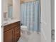 Bathroom featuring vanity, toilet and shower with blue 'Twinkle Twinkle Little Star' curtain at 6254 Woodhaven Village Dr, Port Orange, FL 32128