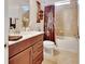 Cozy bathroom featuring a vanity, granite countertop, and shower over tub combination at 6254 Woodhaven Village Dr, Port Orange, FL 32128