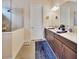 Bathroom featuring double sink vanity with stone countertops and glass enclosed shower at 6254 Woodhaven Village Dr, Port Orange, FL 32128